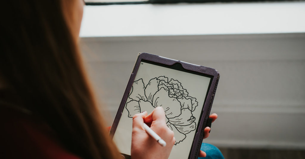 woman drawing peony on iPad