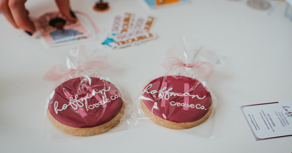 Custom cookies decorated with Hoffman Creative Co. logo on them